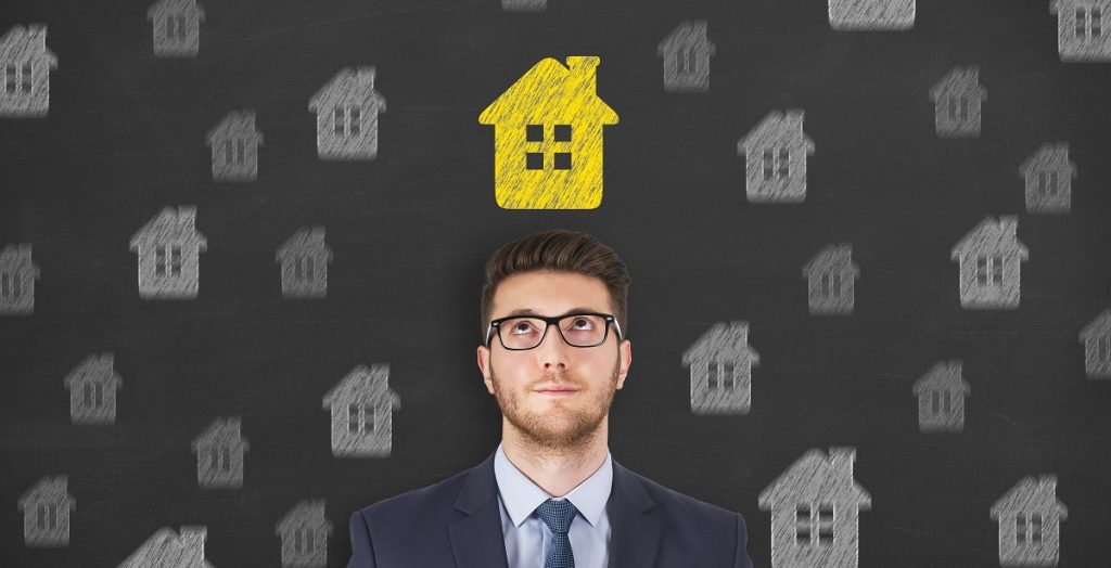man with yellow house above his head