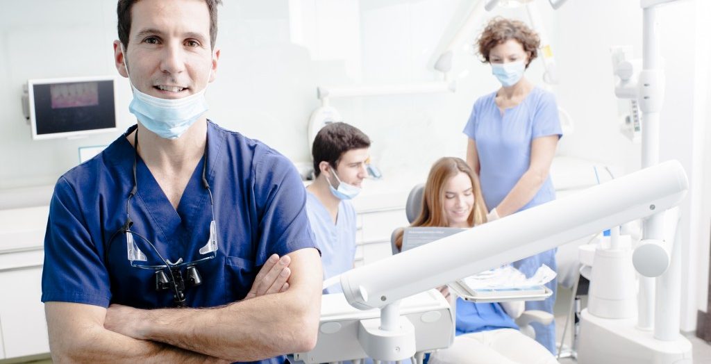 dentist with his team