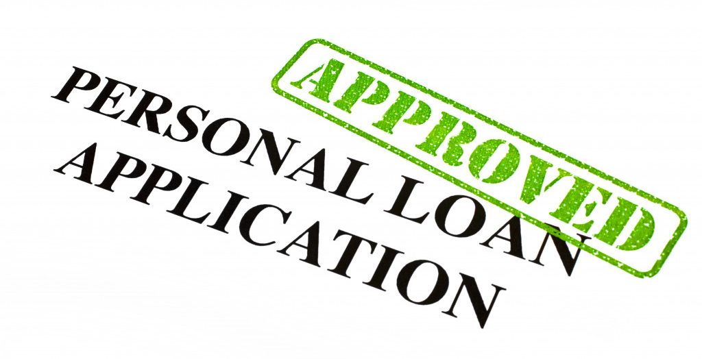 A close-up of an APPROVED Personal Loan Application document.