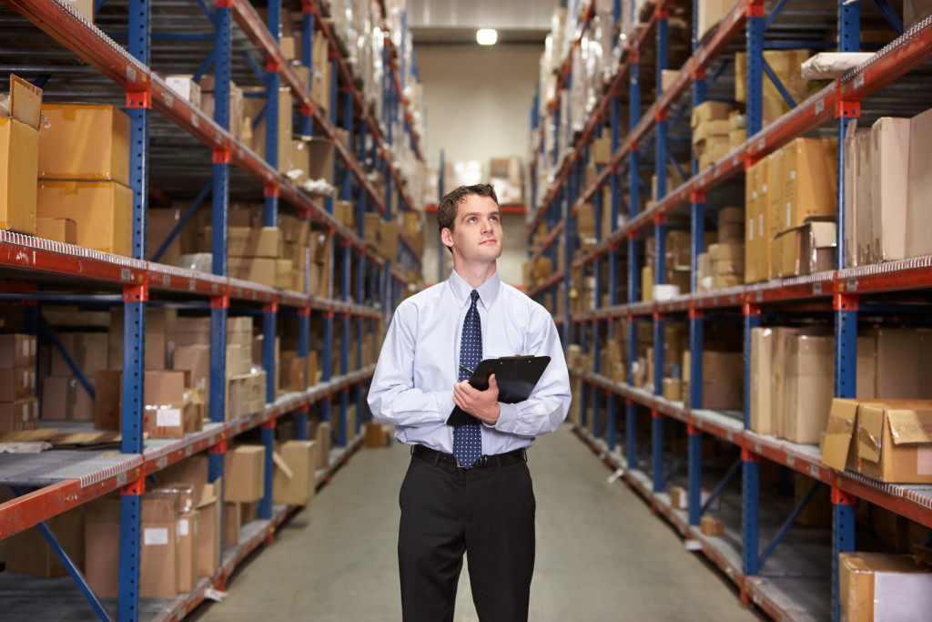 man checking the warehouse