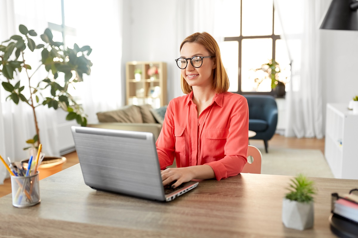 a woman with a laptop working